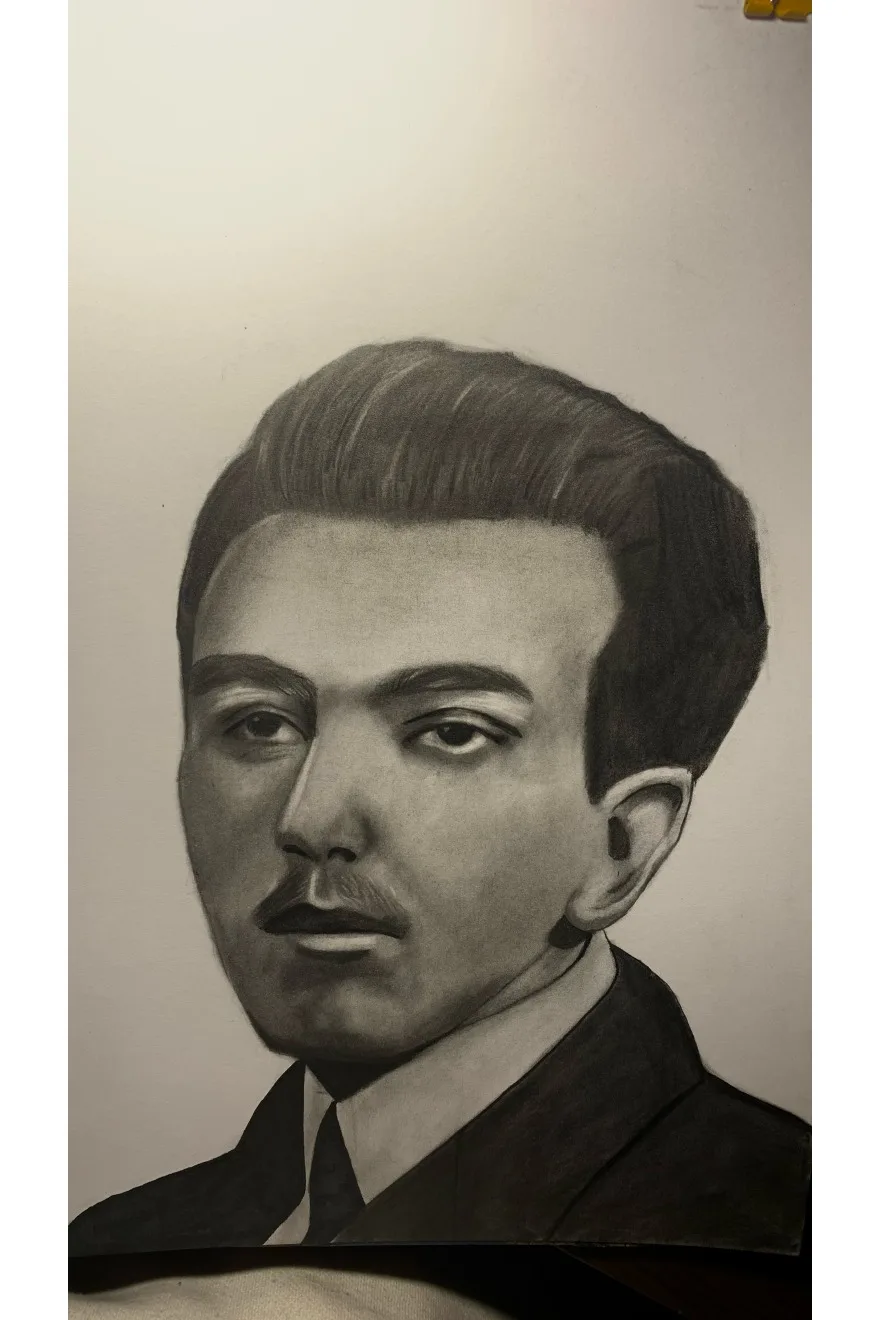 Graphite portrait photographed on paper by Vanessa.