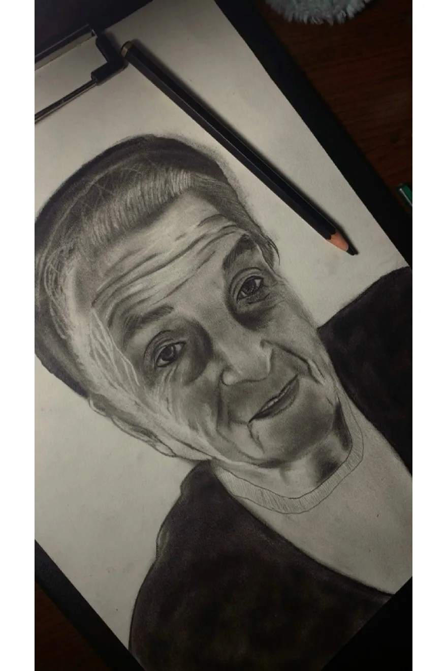 Graphite portrait study photographed from Vanessa's artwork PDF.